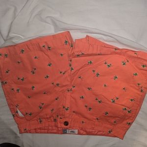 Pink shorts with palm trees